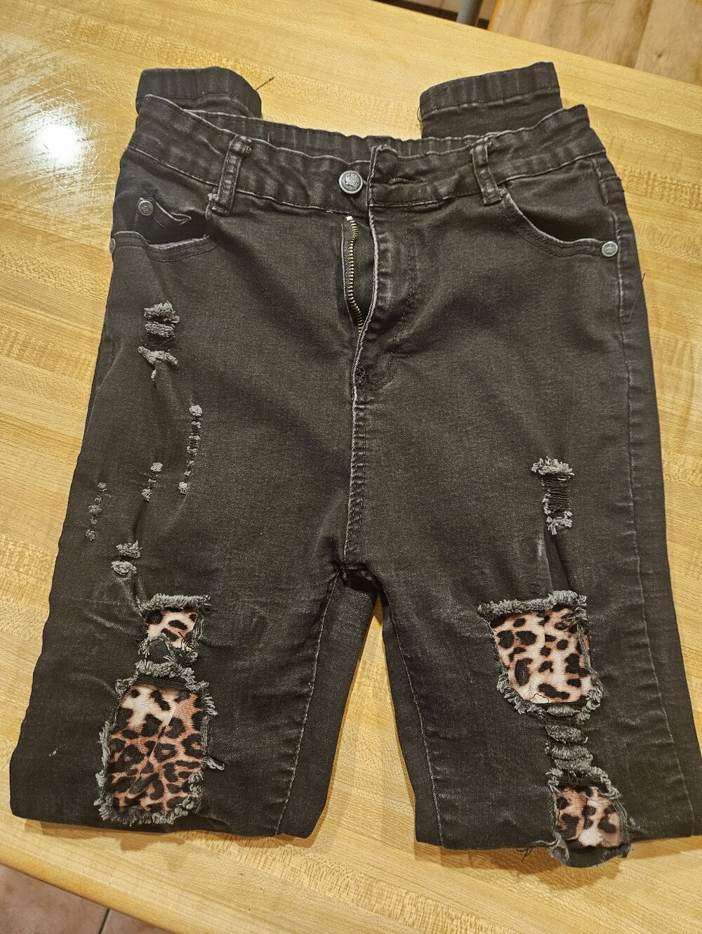 Women’s Distressed Black Jeans with Leopard Patch